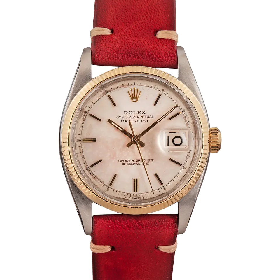 Rolex Datejust 6605 with a rose-tinted dial, fluted gold bezel and steel and gold case on a red leather strap, a pre-owned example, front view of the whole watch