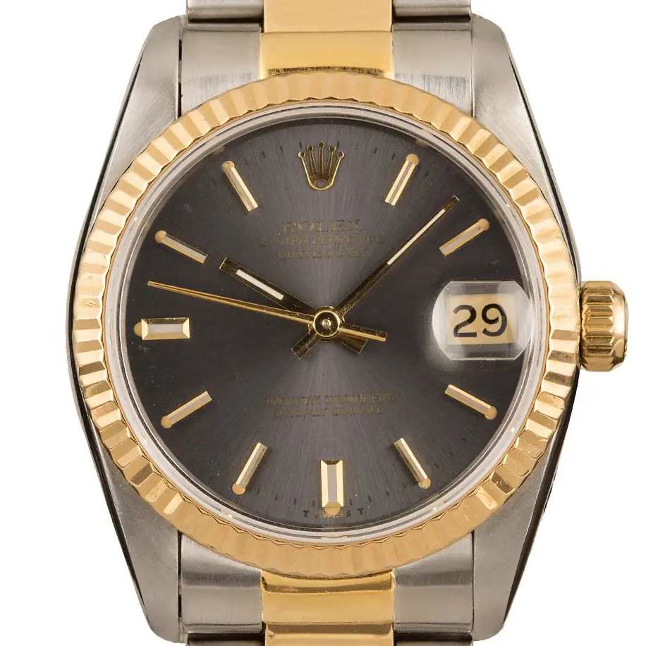 Rolex Datejust 31 68243 with a grey dial, fluted yellow gold bezel and steel and gold Jubilee bracelet, a pre-owned example, studio close-up of the case