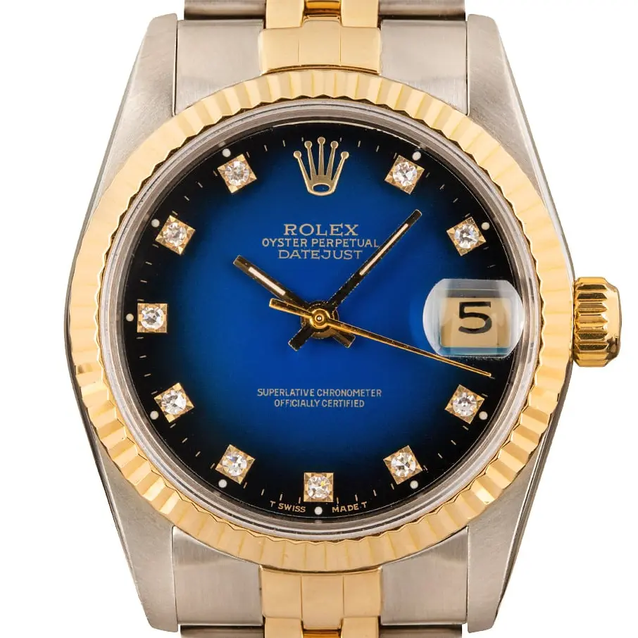 Rolex Datejust 31 68273 with a blue vignette dial with diamond markers and fluted yellow gold bezel in steel and yellow gold on a Jubilee bracelet, a pre-owned example, studio close-up of the case