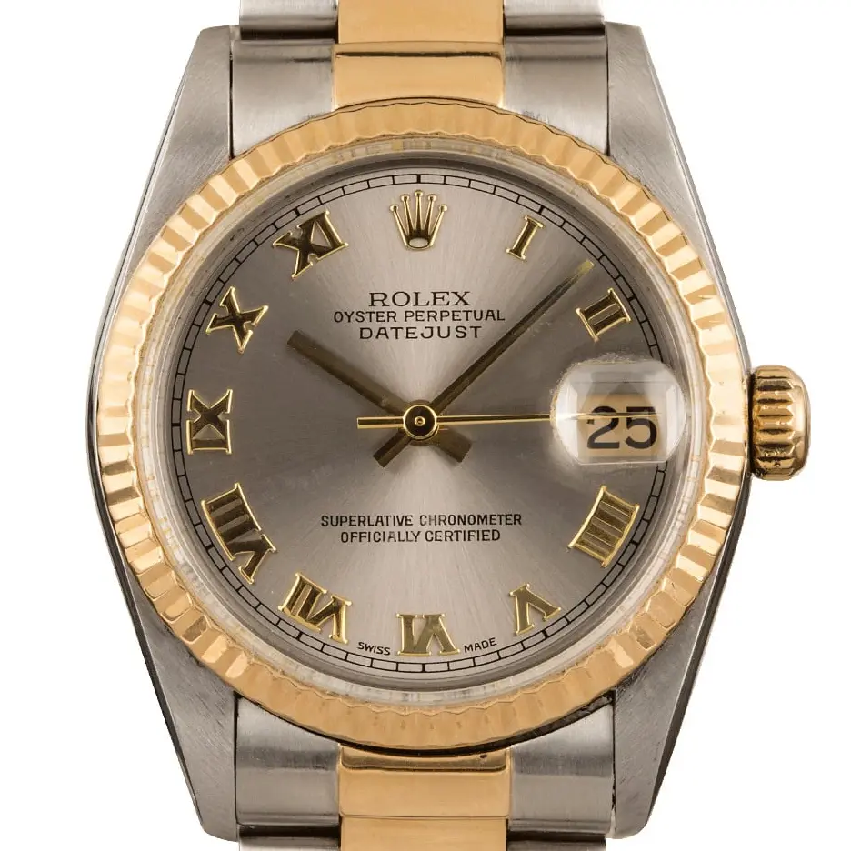 Rolex Datejust 31 78273 with a slate dial with Roman numerals and fluted yellow gold bezel in steel and yellow gold on an Oyster bracelet, a pre-owned example, studio close-up of the case