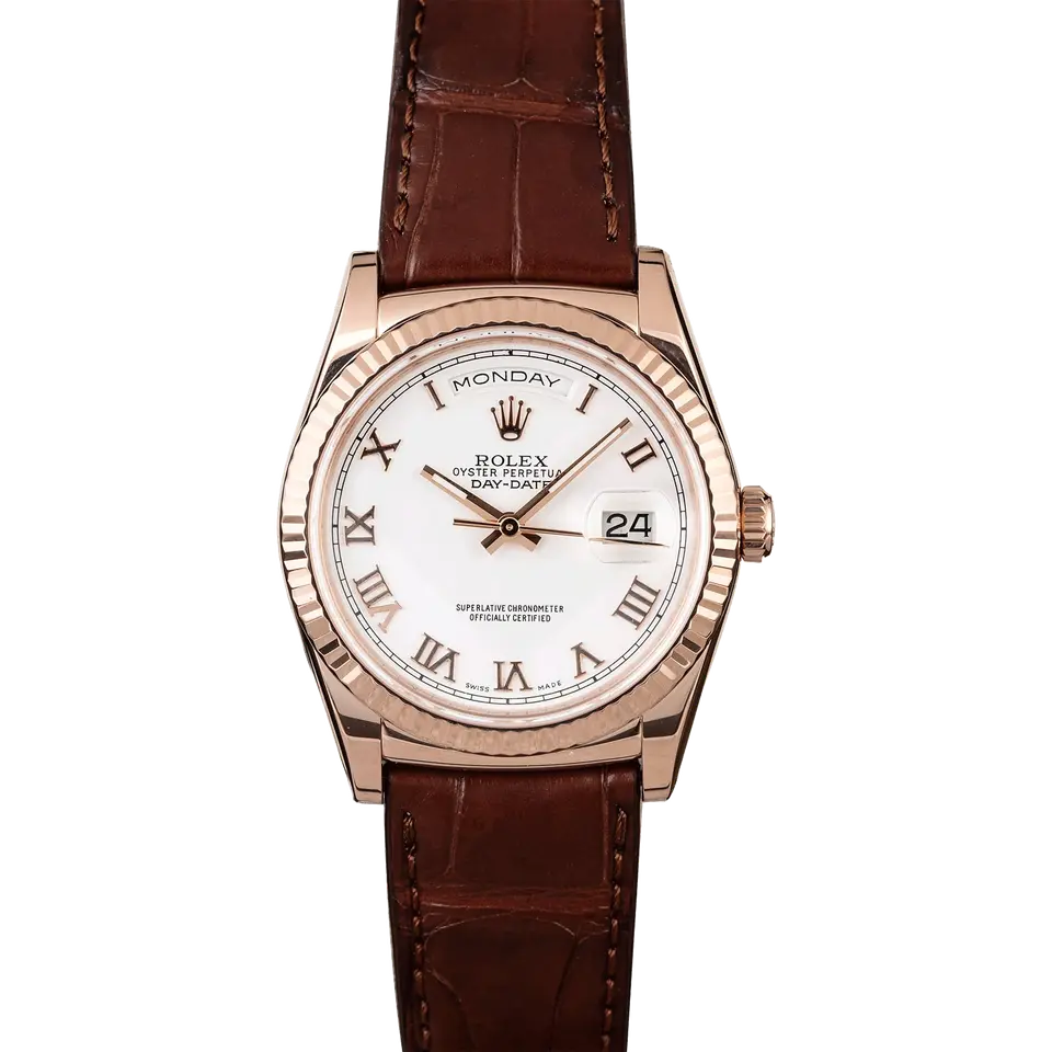 Rolex Day-Date 36 118135 with a white dial with Roman numerals and fluted bezel in Everose gold on a brown leather strap, a pre-owned example, front view of the whole watch