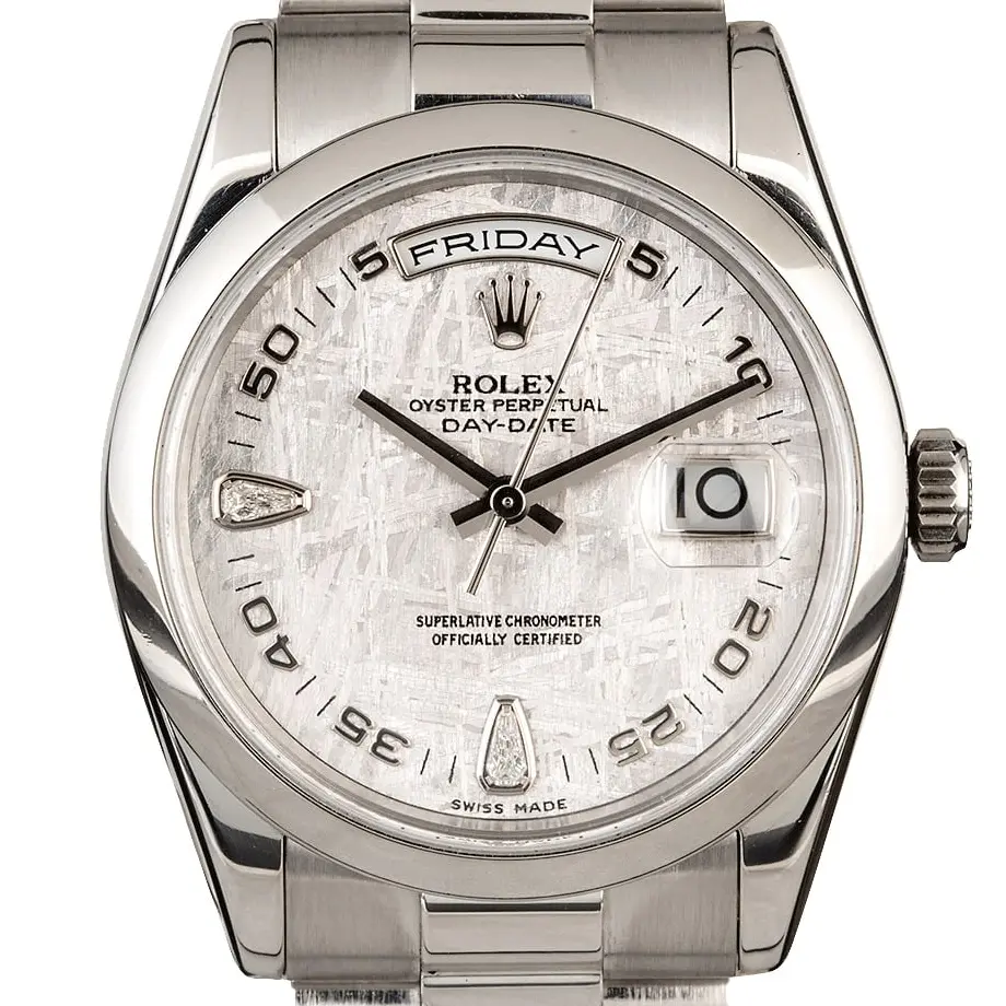 Rolex Day-Date 36 118206 with a meteorite dial with diamond markers and smooth bezel in platinum on a President bracelet, a pre-owned example, studio close-up of the case