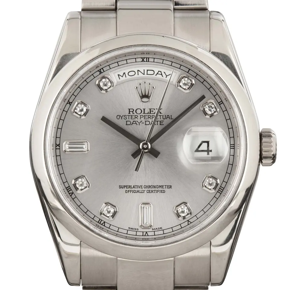 Rolex Day-Date 118209 with a silver dial with diamond hour markers, smooth white gold bezel and white gold President bracelet, a pre-owned example, studio close-up of the case