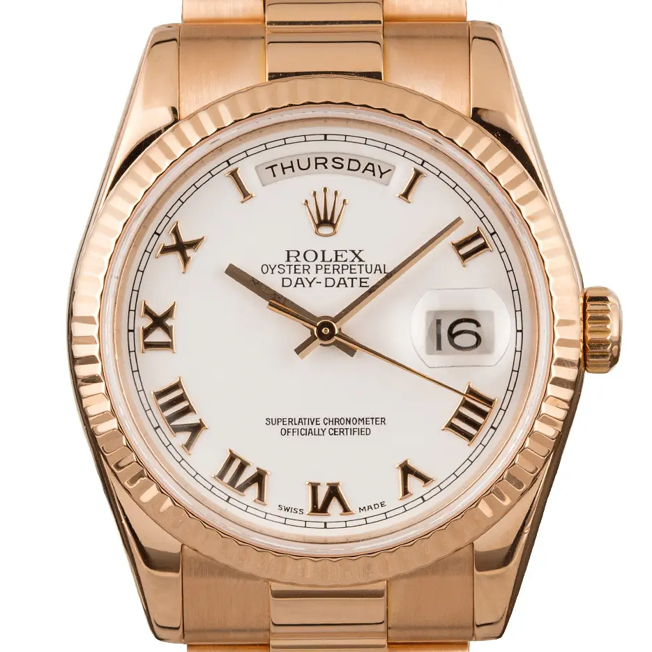 Rolex Day-Date 36 118235 with a white dial with Roman numerals and fluted bezel in Everose gold on a President bracelet, a pre-owned example, studio close-up of the case