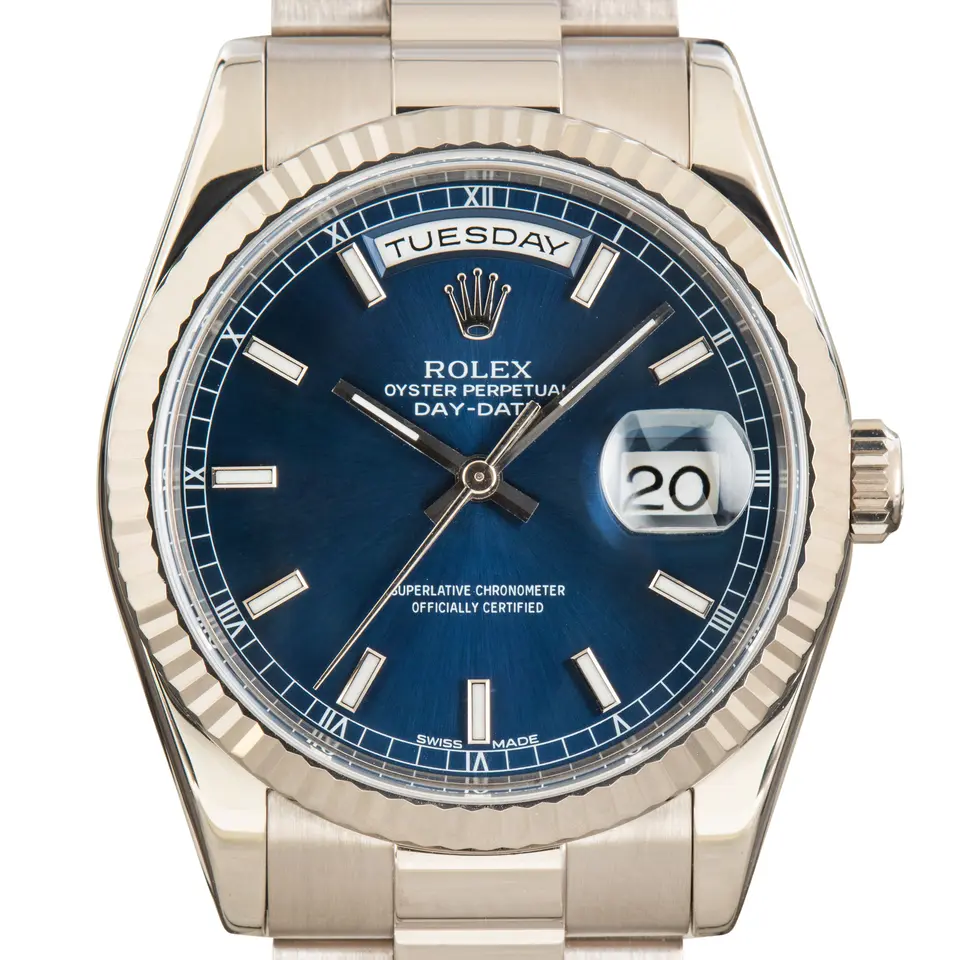 Rolex Day-Date 36 118239 with a blue dial and fluted bezel in white gold on a President bracelet, a pre-owned example, studio close-up of the case