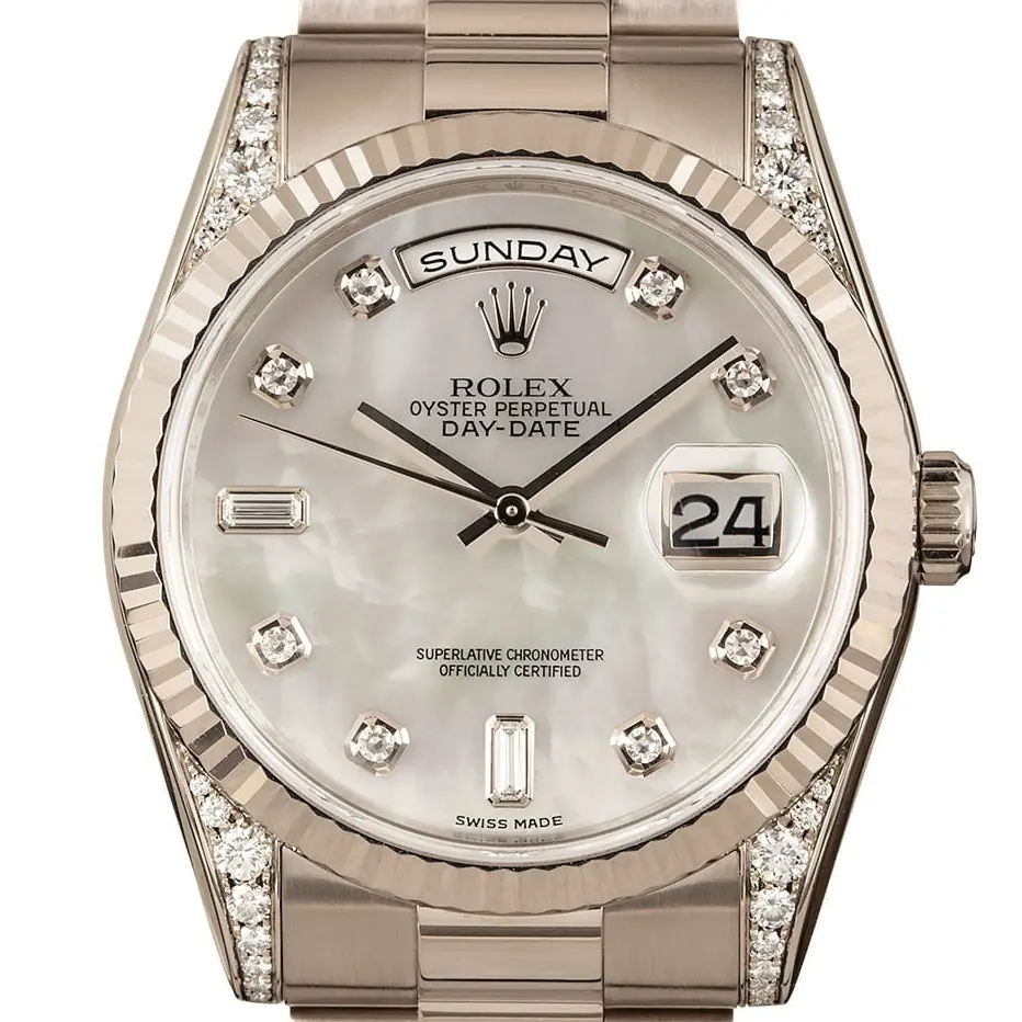 Rolex Day-Date 36 118339 with a mother-of-pearl dial with diamond hour markers, fluted white gold bezel, diamond-set lugs and white gold President bracelet, a pre-owned example, studio close-up of the case