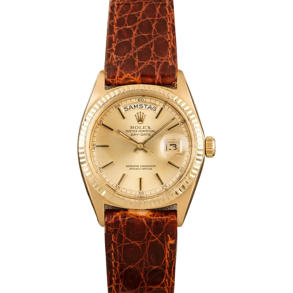 Rolex Day-Date 36 1802 with a champagne dial with a German day disc, fluted yellow gold bezel and yellow gold case on a brown leather strap, a pre-owned example, front view of the whole watch