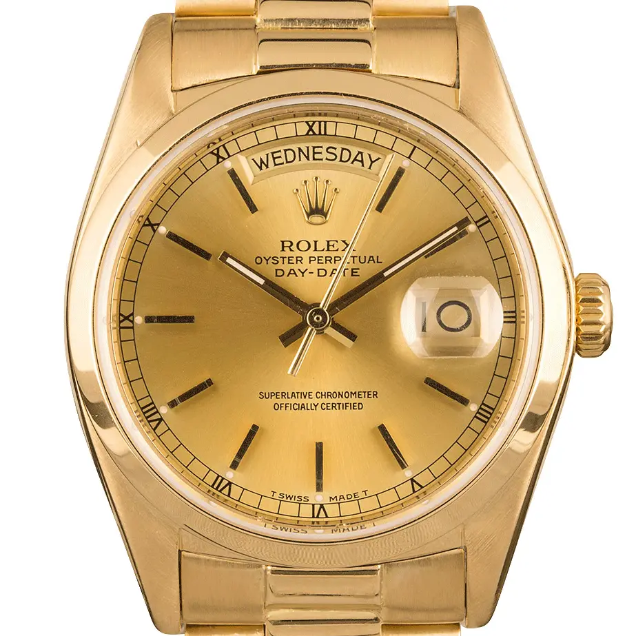 Rolex Day-Date 36 18028 with a champagne dial and fluted bezel in yellow gold on a President bracelet, a pre-owned example, studio close-up of the case