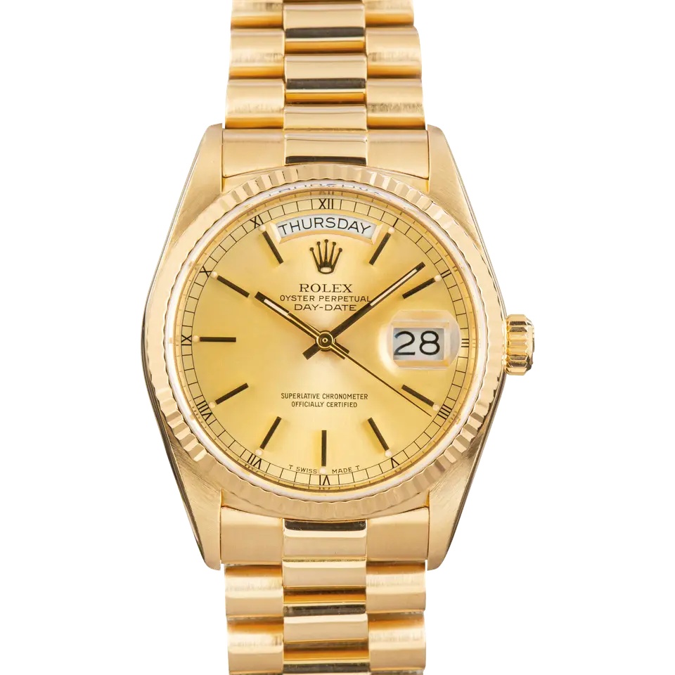 Rolex Day-Date 36 18038 with a champagne dial and fluted bezel in yellow gold on a President bracelet, a pre-owned example, front view of the whole watch