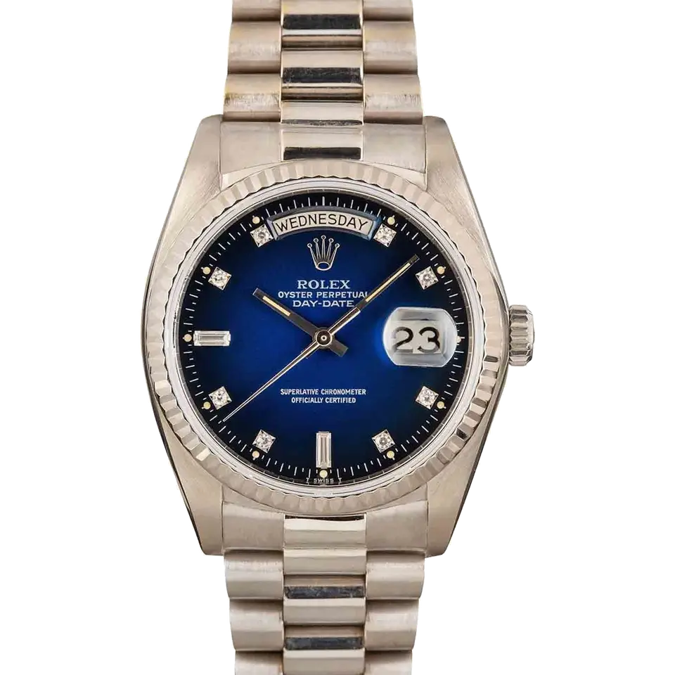 Rolex Day-Date 36 18039 with a blue vignette dial with diamond markers and fluted bezel in white gold on a President bracelet, a pre-owned example, front view of the whole watch