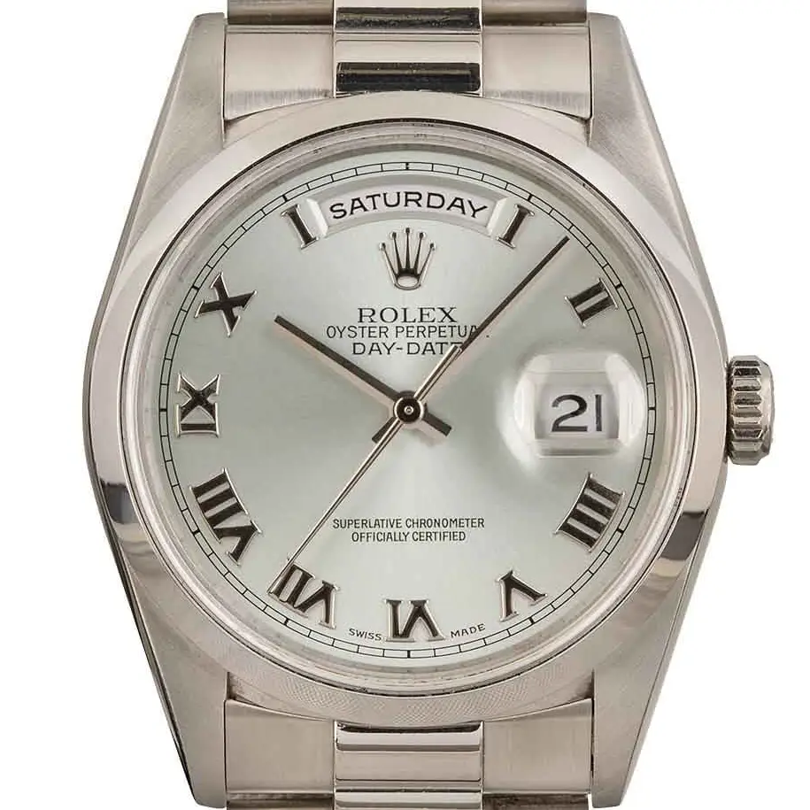 Rolex Day-Date 36 18206 with a silver dial with Roman numerals and smooth bezel in platinum on a President bracelet, a pre-owned example, studio close-up of the case