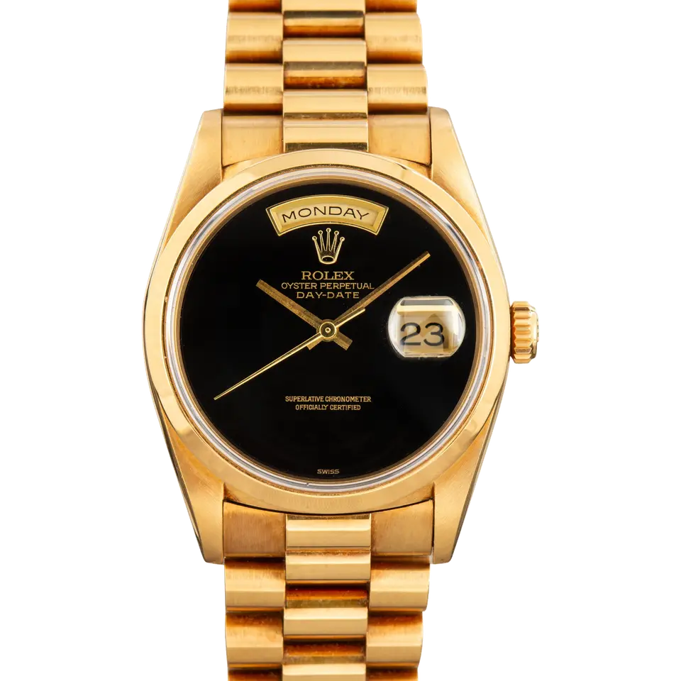 Rolex Day-Date 36 18208 with a black onyx dial, smooth yellow gold bezel and yellow gold President bracelet, a pre-owned example, front view of the whole watch