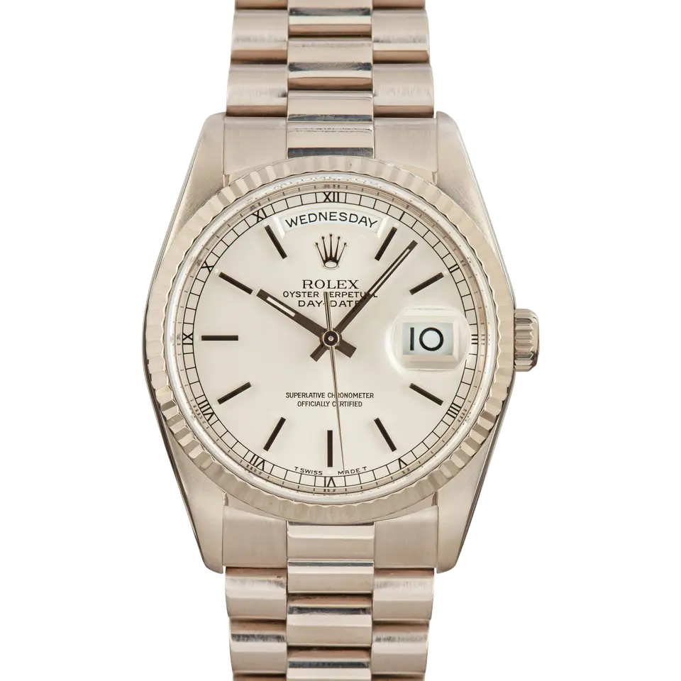 Rolex Day-Date 36 18239 with a silver dial with baton markers and a fluted white gold bezel on a white gold President bracelet, a pre-owned example, front view of the whole watch