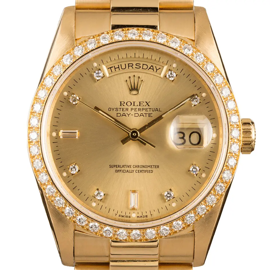 Rolex Day-Date 18348 with a champagne dial with diamond hour markers, diamond-set bezel and yellow gold President bracelet, a pre-owned example, studio close-up of the case