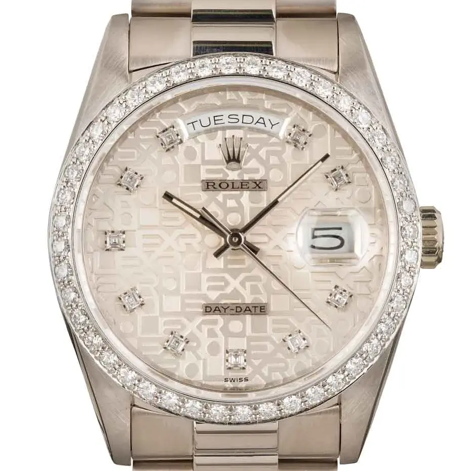 Rolex Day-Date 36 18349 with a silver Jubilee dial with diamond hour markers, diamond-set bezel and white gold President bracelet, a pre-owned example, studio close-up of the case