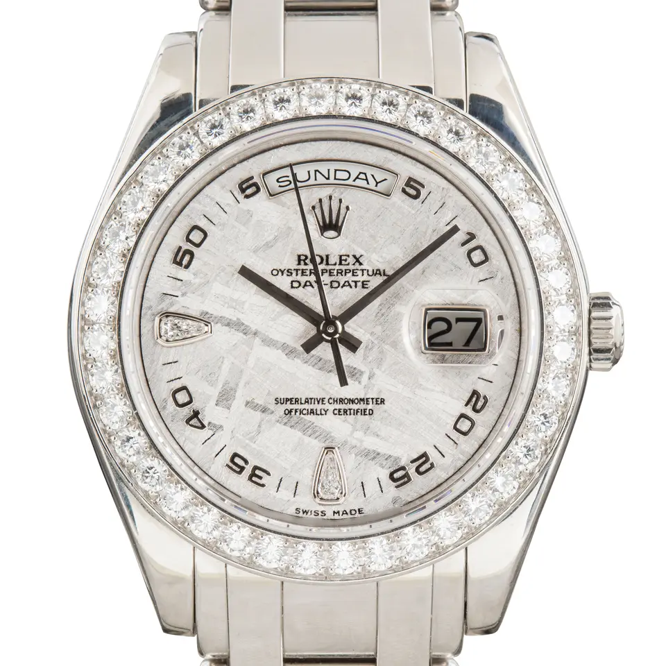 Rolex Day-Date 39 18946 with a meteorite dial with diamond markers, diamond-set bezel and platinum Masterpiece bracelet, a pre-owned example, studio close-up of the case
