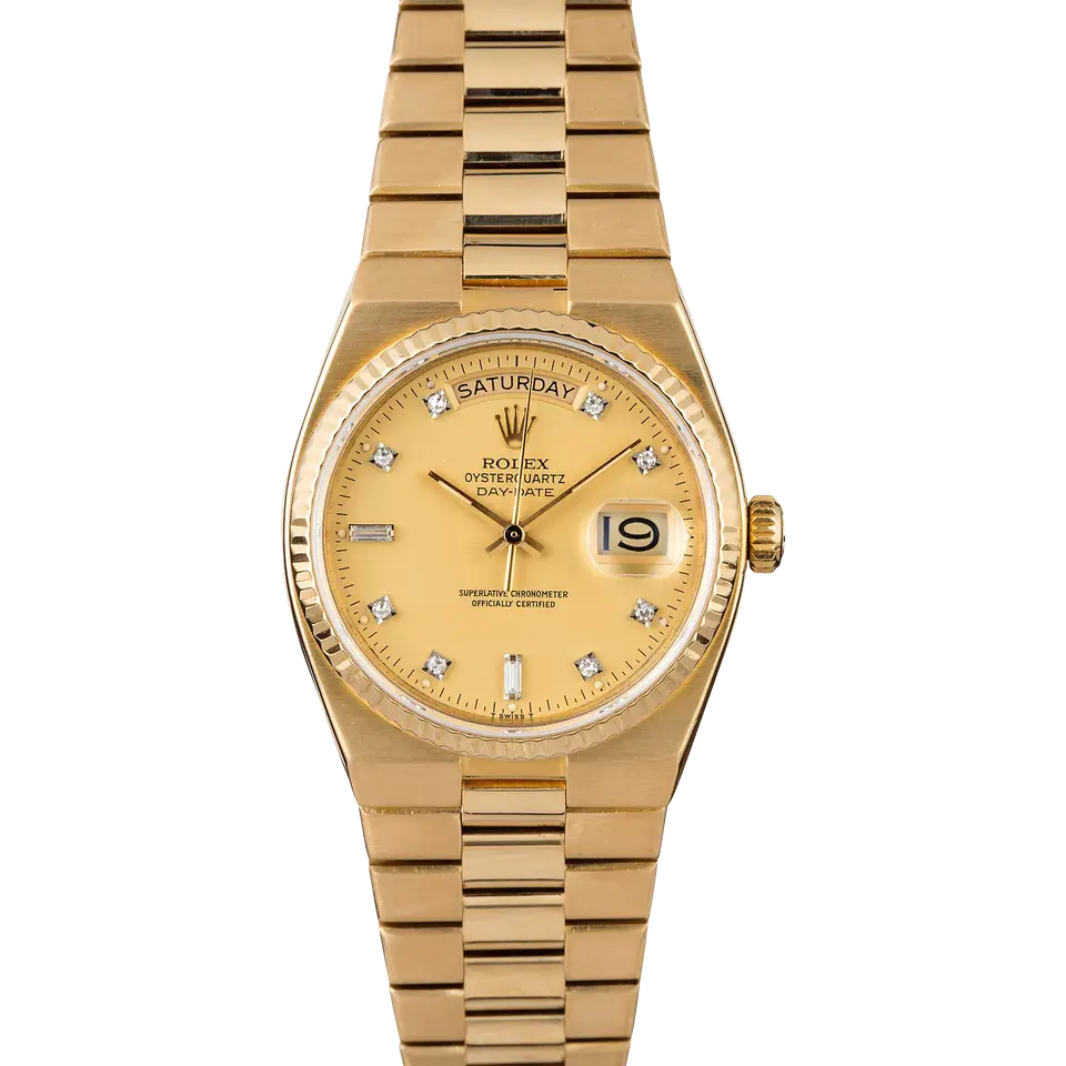 Rolex Day-Date 19018 with a champagne dial with diamond markers in yellow gold on an integrated Oysterquartz bracelet, a pre-owned example, front view of the whole watch