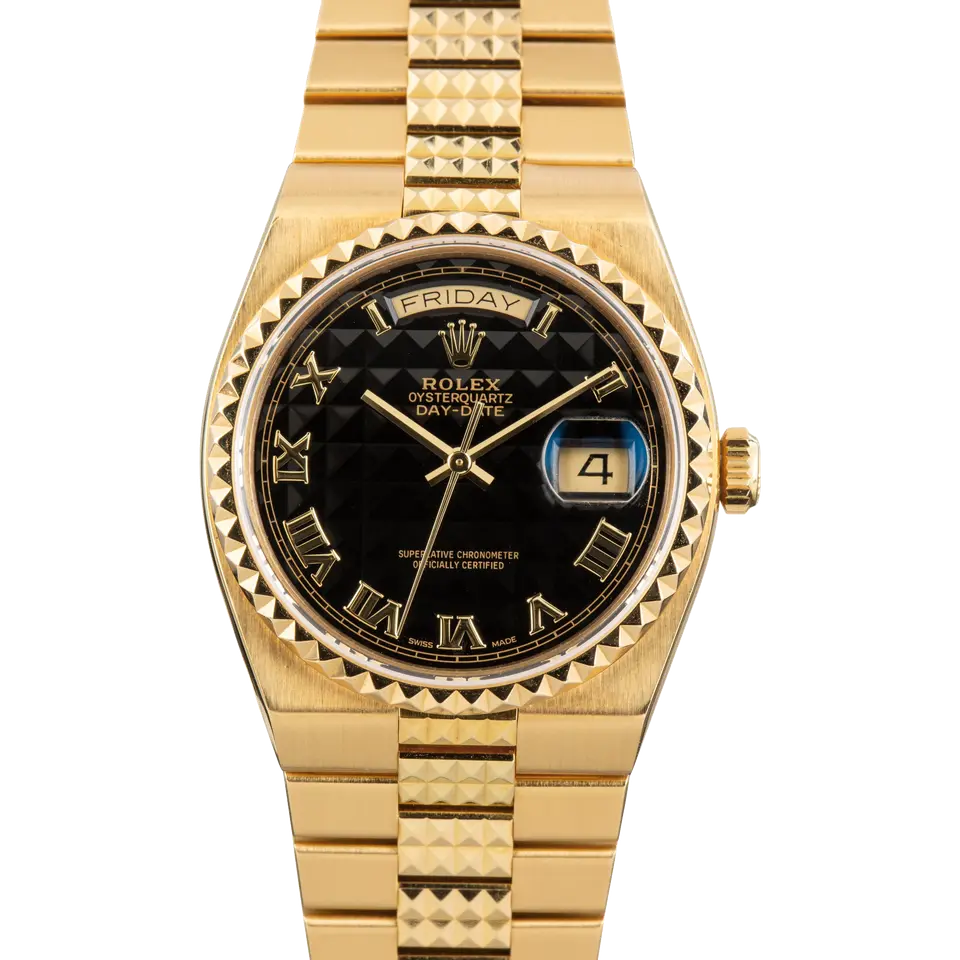 Rolex Oysterquartz Day-Date 19028 with a black pyramid Roman-numeral Oysterquartz dial, pyramid yellow gold bezel and integrated yellow gold bracelet, a pre-owned example, front view of the whole watch