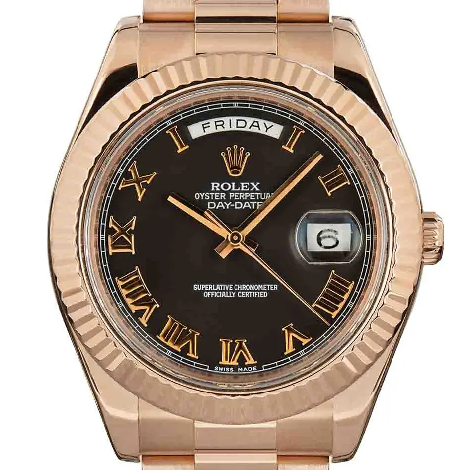 Rolex Day-Date II 218235 with a black dial with Roman numerals and fluted bezel in Everose gold on a President bracelet, a pre-owned example, studio close-up of the case