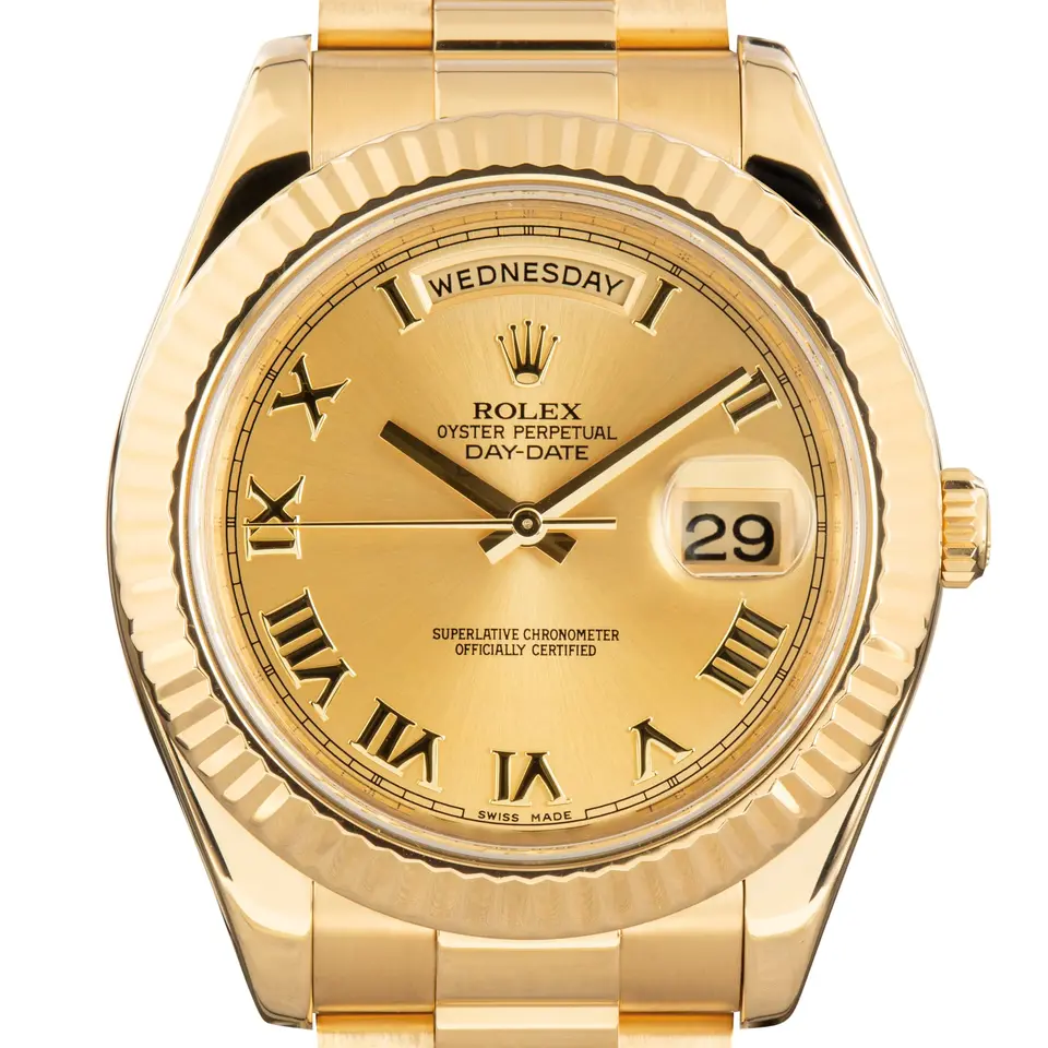 Rolex Day-Date II 218238 with a champagne dial with Roman numerals and fluted bezel in yellow gold on a President bracelet, a pre-owned example, studio close-up of the case