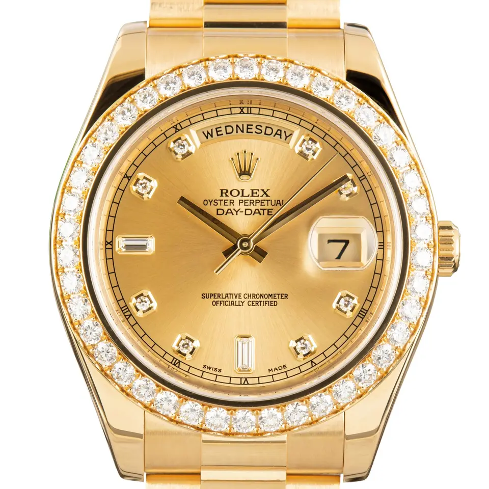 Rolex Day-Date II 218348 with a champagne dial with diamond hour markers, diamond-set bezel and yellow gold President bracelet, a pre-owned example, studio close-up of the case