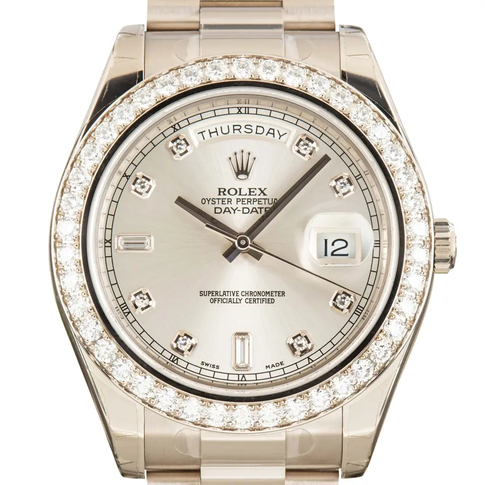 Rolex Day-Date II 218349 with a silver dial with diamond markers and diamond-set bezel in white gold on a President bracelet, a pre-owned example, studio close-up of the case