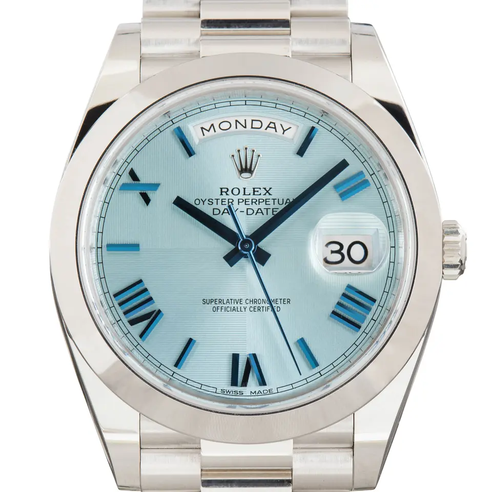 Rolex Day-Date 40 228206 with an ice blue dial with Roman numerals and smooth bezel in platinum on a President bracelet, a pre-owned example, studio close-up of the case