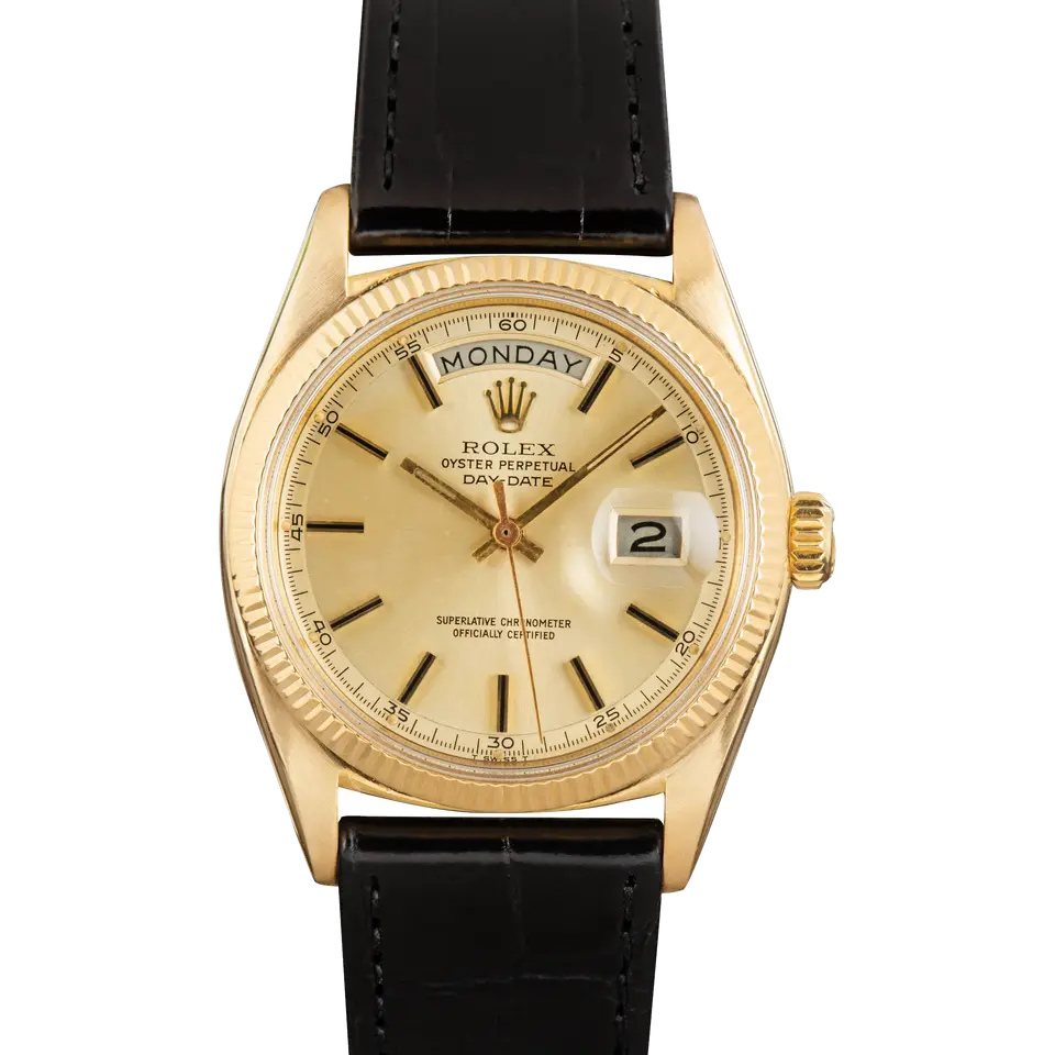 Rolex Day-Date 6611 with a champagne dial with baton markers and a fluted yellow gold bezel on a black leather strap, a pre-owned example, front view of the whole watch
