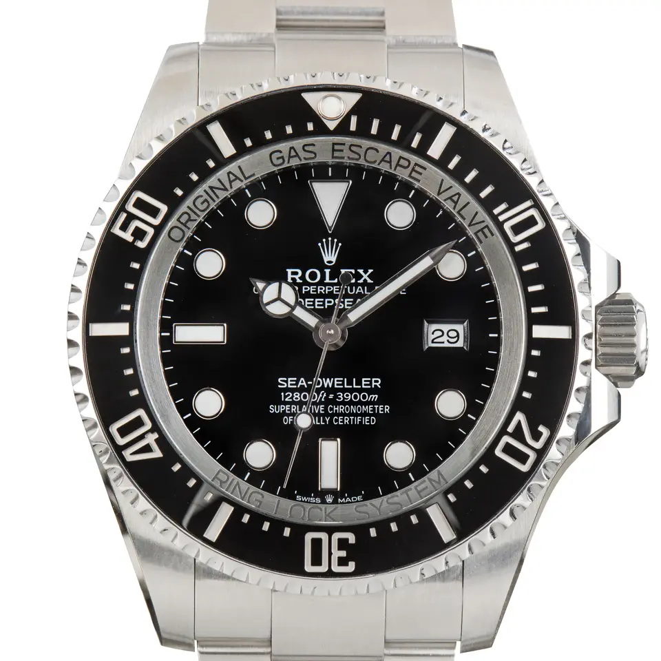 Rolex Sea-Dweller Deepsea 126660 with a black dial and black ceramic diving bezel on a steel Oyster bracelet, a pre-owned example, studio close-up of the case