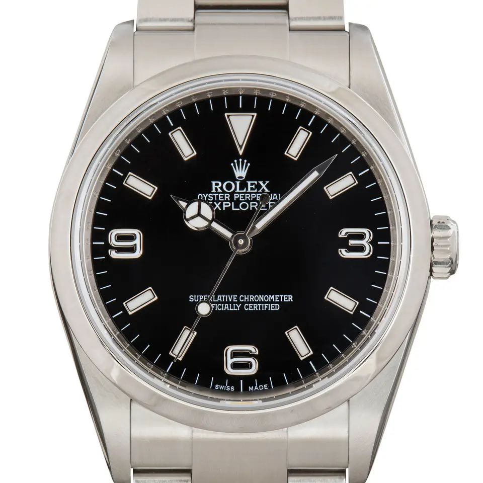 Rolex Explorer 114270 with a black dial with 3, 6 and 9 numerals on a steel Oyster bracelet, a pre-owned example, studio close-up of the case