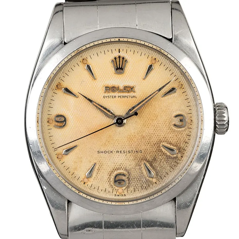 Rolex Explorer 6298 with an aged honeycomb dial with 3, 6 and 9 numerals, smooth steel bezel and steel Oyster bracelet, a pre-owned example, studio close-up of the case