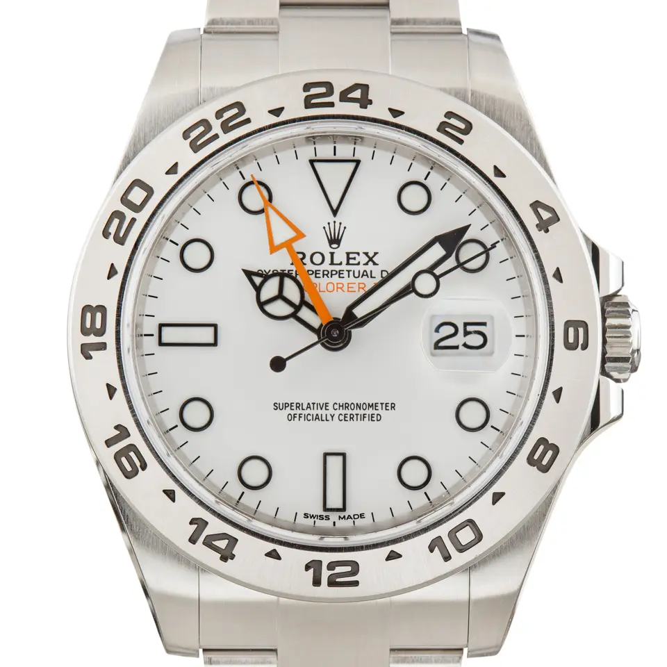 Rolex Explorer II 216570 with a white dial, orange 24-hour hand and fixed steel 24-hour bezel on an Oyster bracelet, a pre-owned example, studio close-up of the case