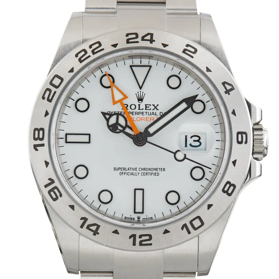 Rolex Explorer II 226570 with a white dial, orange 24-hour hand and a fixed steel 24-hour bezel, a pre-owned example, studio close-up of the case