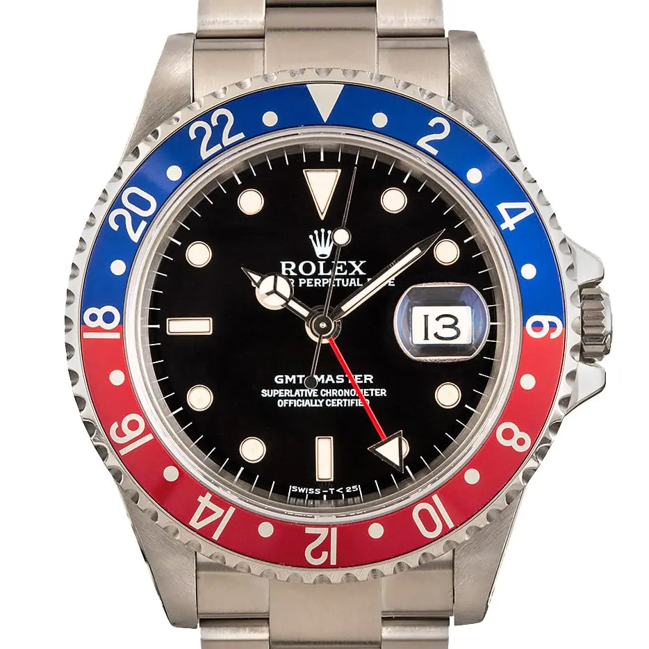Rolex GMT-Master 16700 with a black dial and blue and red aluminium bezel insert on a steel Oyster bracelet, a pre-owned example, studio close-up of the case