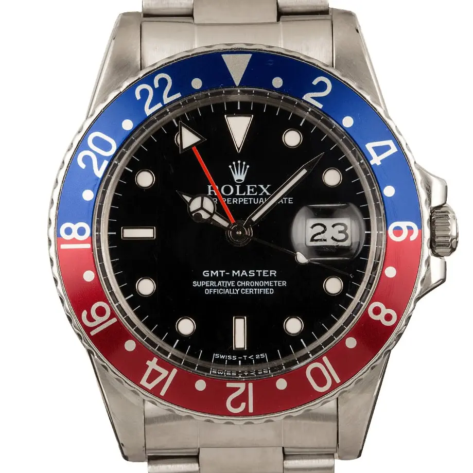 Rolex GMT-Master 16750 with a black dial and blue and red aluminium bezel insert on a steel Oyster bracelet, a pre-owned example, studio close-up of the case