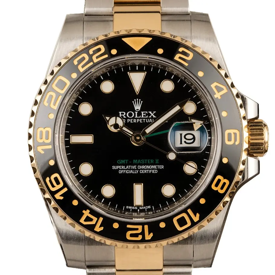 Rolex GMT-Master II 116713LN with a black dial and black ceramic bezel in steel and yellow gold on an Oyster bracelet, a pre-owned example, studio close-up of the case