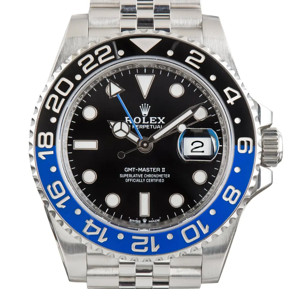 Rolex GMT-Master II 126710BLNR with a black dial and blue and black ceramic bezel, a pre-owned example, studio close-up of the case