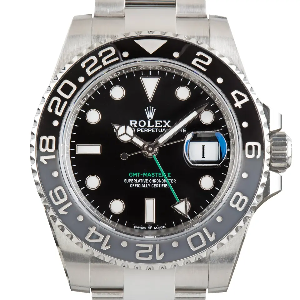 Rolex GMT-Master II 126710GRNR with a black dial, green GMT hand and grey and black ceramic bezel, a pre-owned example, studio close-up of the case