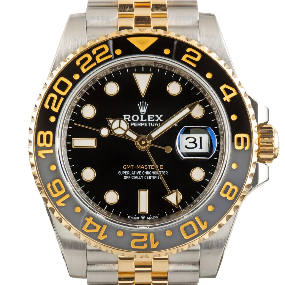 Rolex GMT-Master II 126713GRNR with a black dial and a grey and black ceramic bezel, a pre-owned example, studio close-up of the case