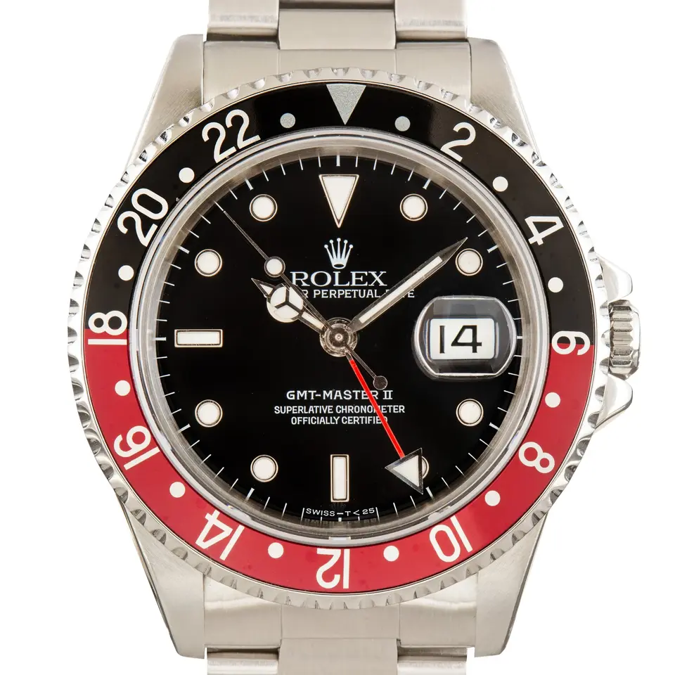 Rolex GMT-Master II 16710 with a black dial and red and black aluminium bezel insert on a steel Oyster bracelet, a pre-owned example, studio close-up of the case