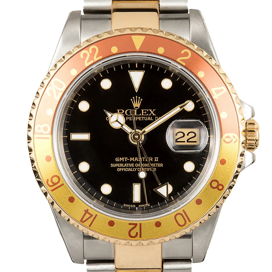 Rolex GMT-Master II 16713 with a black dial and brown and gold bezel in steel and yellow gold on an Oyster bracelet, a pre-owned example, studio close-up of the case