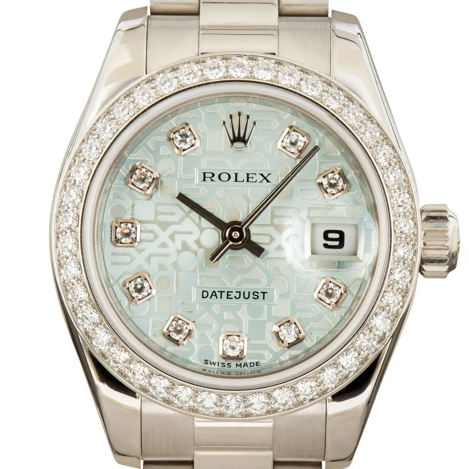 Rolex Lady-Datejust 179136 with an ice-blue Jubilee dial with diamond hour markers, diamond-set bezel and platinum President bracelet, a pre-owned example, studio close-up of the case