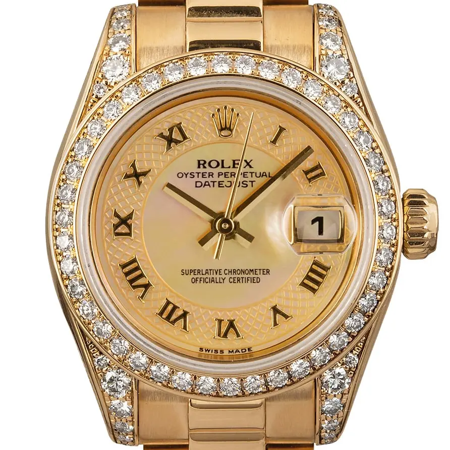 Rolex Lady-Datejust 26 179158 with a champagne Roman-numeral dial, diamond-set bezel and lugs and yellow gold President bracelet, a pre-owned example, studio close-up of the case
