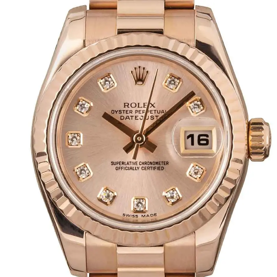 Rolex Lady-Datejust 26 179175 with a pink dial with diamond hour markers, fluted Everose gold bezel and Everose gold President bracelet, a pre-owned example, studio close-up of the case