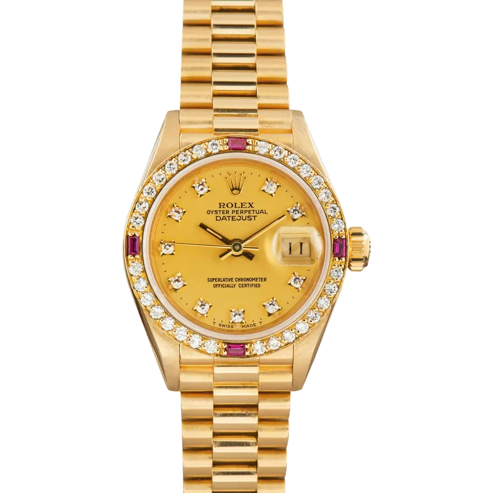 Rolex Lady-Datejust 69068 with a champagne dial with diamond hour markers, bezel set with diamonds and rubies and yellow gold President bracelet, a pre-owned example, front view of the whole watch