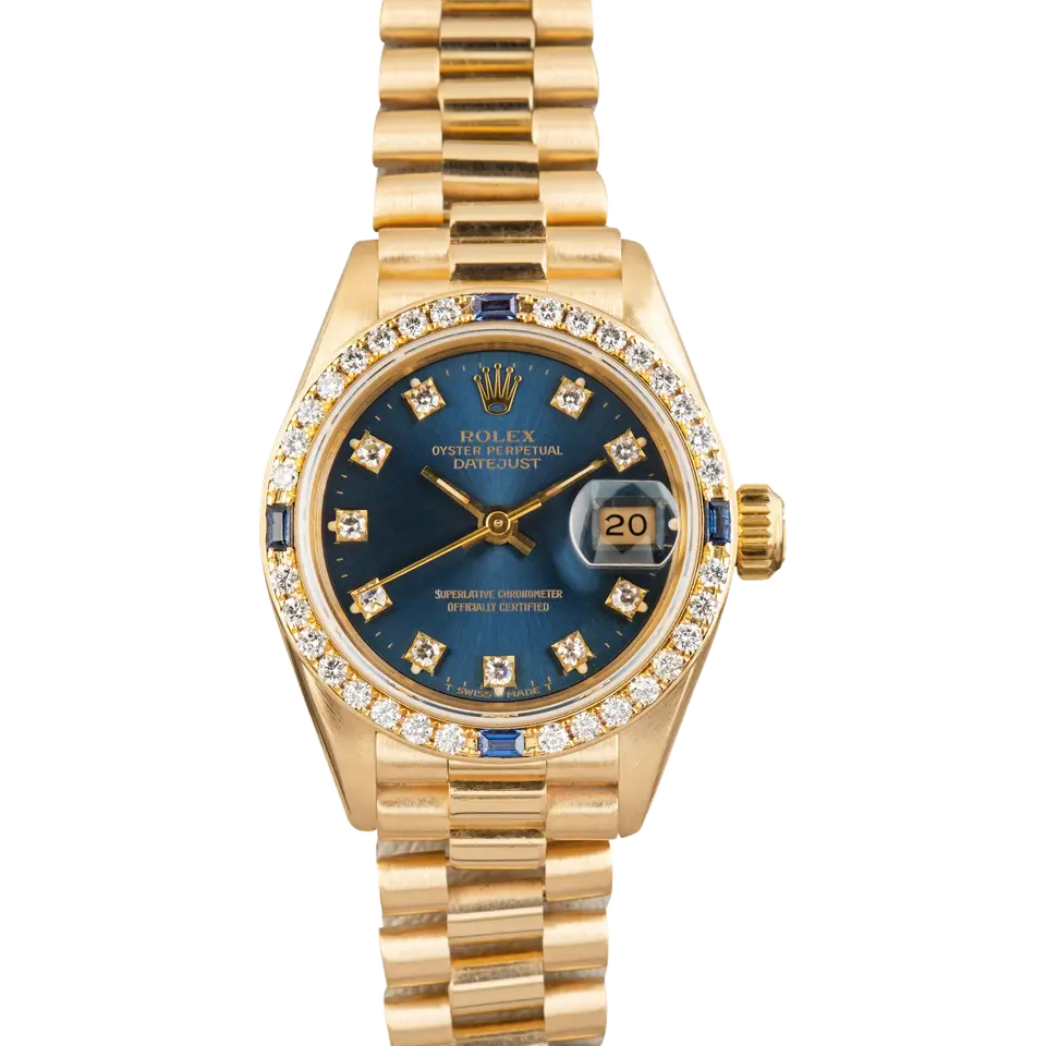 Rolex Lady-Datejust 26 69088 with a blue vignette dial with diamond hour markers, bezel set with diamonds and sapphires and yellow gold President bracelet, a pre-owned example, front view of the whole watch