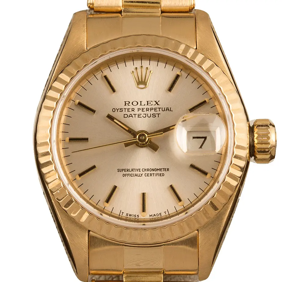 Rolex Lady-Datejust 26 69138 with a silver dial, fluted yellow gold bezel and yellow gold President bracelet, a pre-owned example, studio close-up of the case