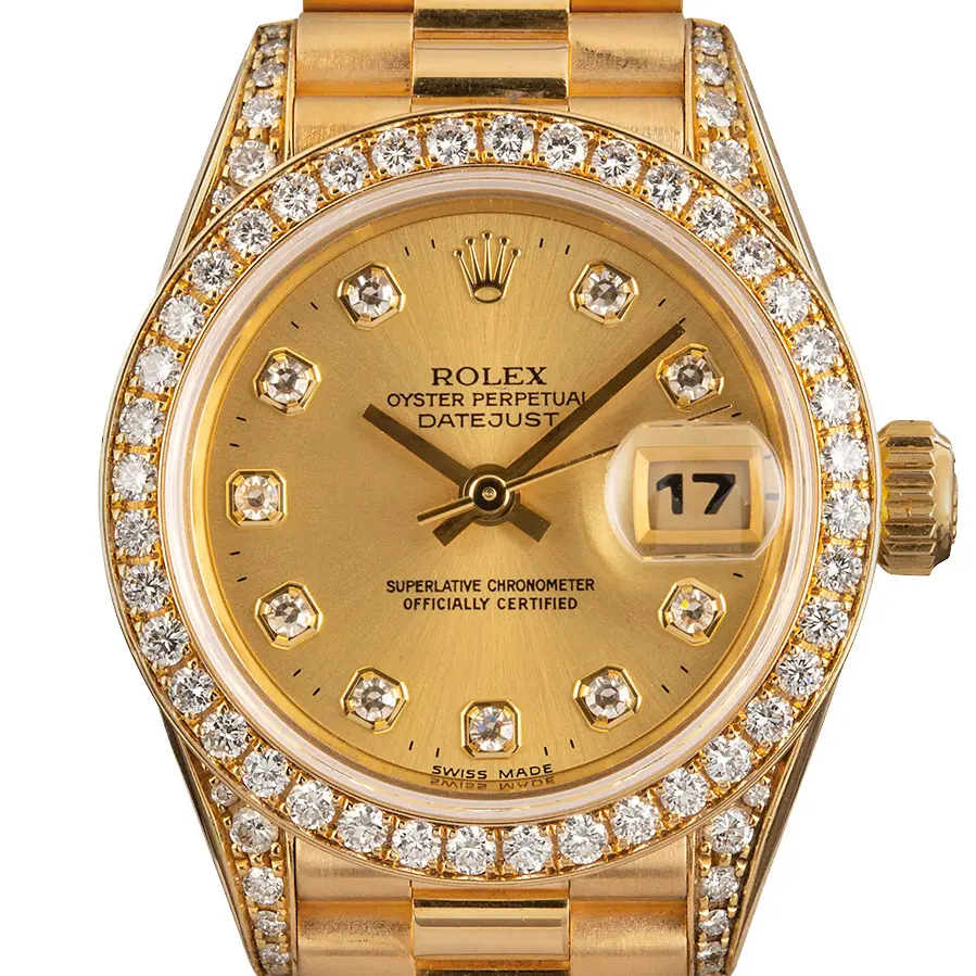Rolex Lady-Datejust 26 69158 with a champagne dial with diamond hour markers, diamond-set bezel, diamond-set lugs and yellow gold President bracelet, a pre-owned example, studio close-up of the case