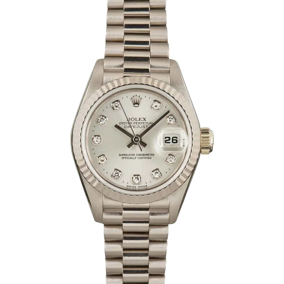 Rolex Lady-Datejust 69179 with a silver dial with diamond hour markers and a fluted white gold bezel on a white gold President bracelet, a pre-owned example, front view of the whole watch