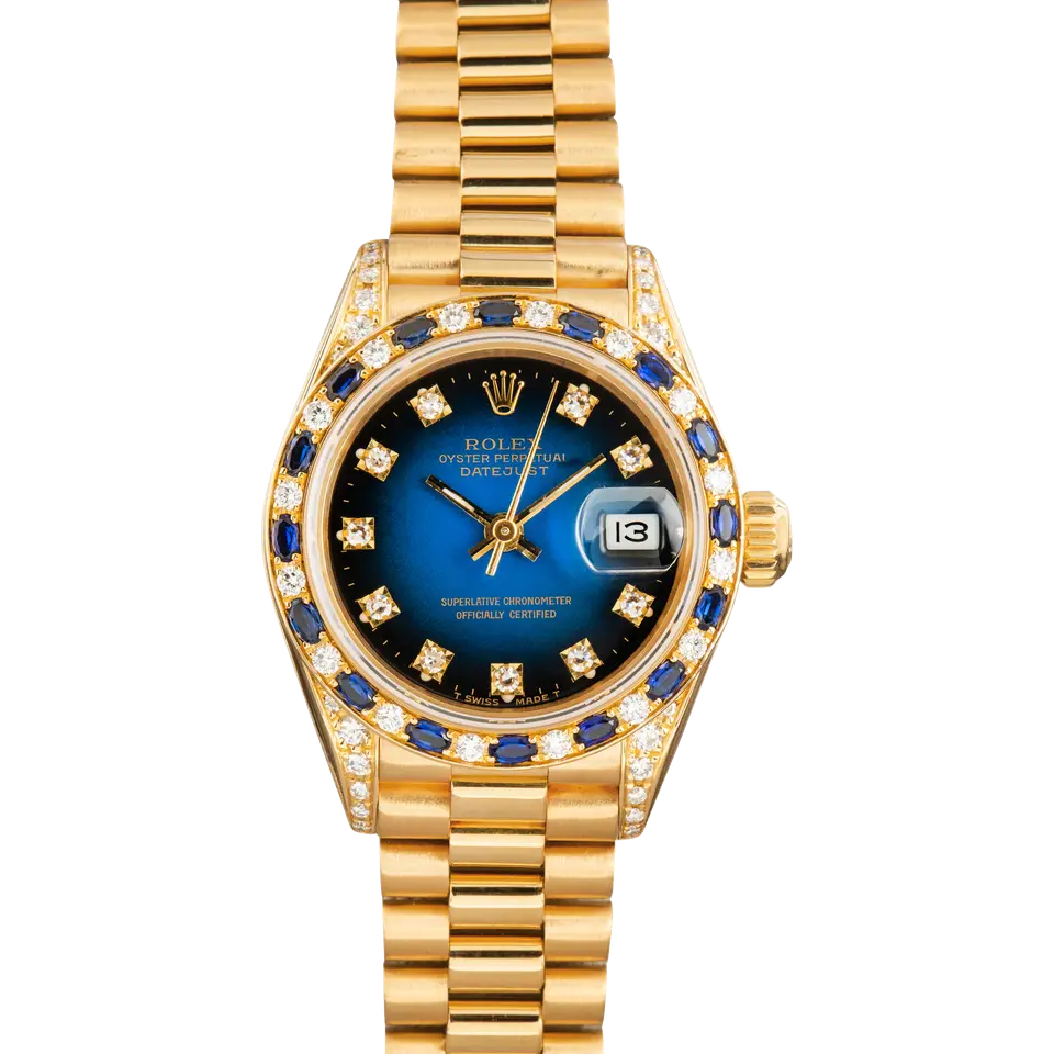 Rolex Lady-Datejust 69238 with a blue vignette dial with diamond hour markers, bezel set with diamonds and sapphires and yellow gold President bracelet, a pre-owned example, front view of the whole watch
